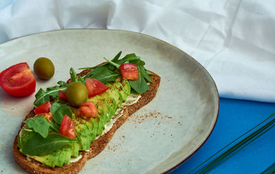 High angle view of fresh vegetables in plate on table