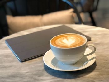 Close-up of cappuccino on table