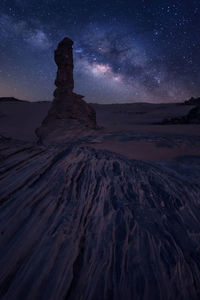 Scenic view of landscape against sky at night