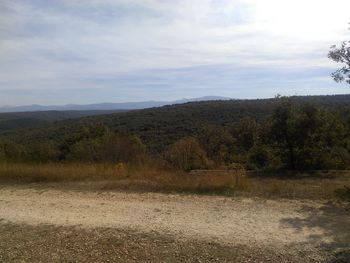 View of landscape against cloudy sky