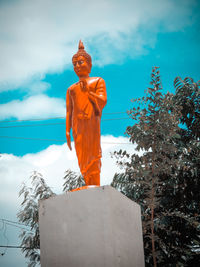 Low angle view of statue against sky