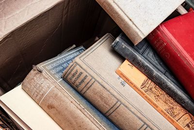 High angle view of old books on table