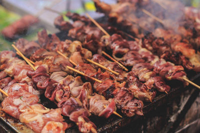 Close-up of meat on barbecue grill