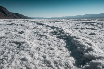 Scenic view of arid landscape against clear sky