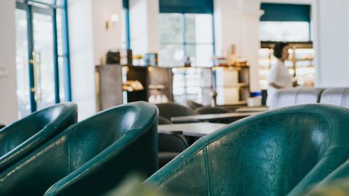 Close-up of empty chairs and table