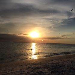 Scenic view of sea against sky at sunset