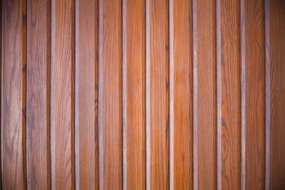 Brown wood background with new, blunt and regular strips