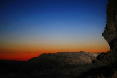 Scenic view of mountains against sky during sunset