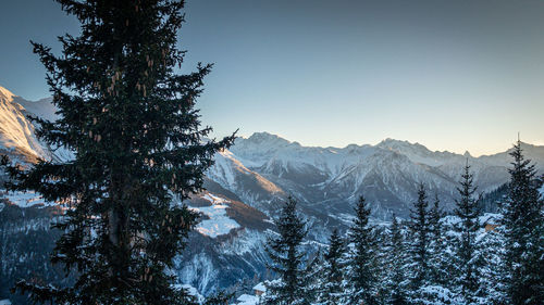 Scenic view of snowcapped mountains against clear sky