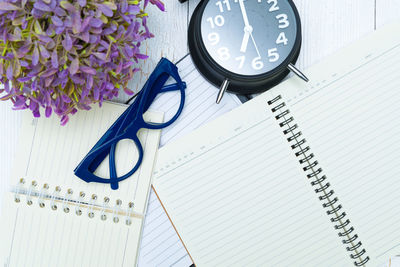 High angle view of clock on table