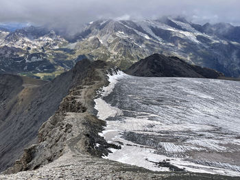 Ridge high-altitude trail with glacier panorama, val d'isere, aiguille de la grande sassière