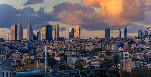 Cityscape against sky during sunset