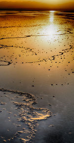 Scenic view of beach against sky during sunset