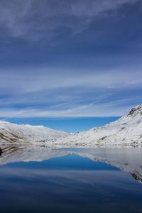 Scenic view of frozen landscape against sky