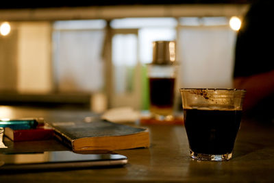 Close-up of beer glass on table