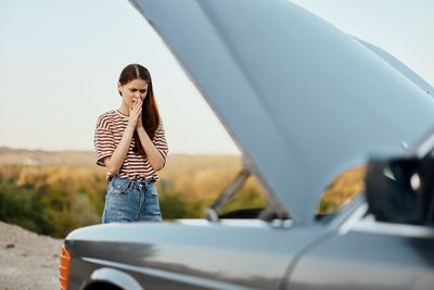 Low angle view of woman in car