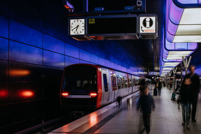 Blurred motion of train at railroad station