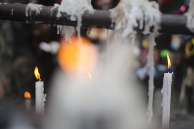 Close-up of burning candles