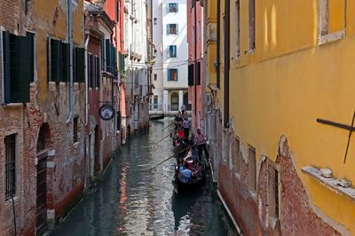 Canal amidst buildings in city