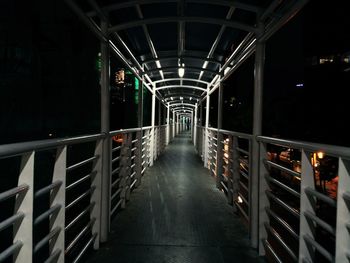 Illuminated footbridge at night