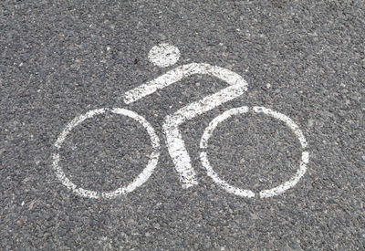 High angle view of bicycle lane sign on road