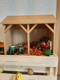 Various fruits in box on table at home