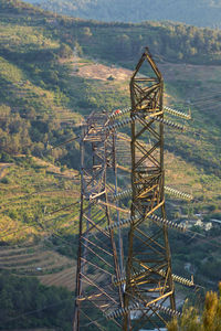 High angle view of power limes metallic structure on land