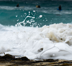 Close-up of sea waves splashing on shore