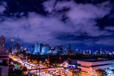 High angle view of illuminated buildings in city at night