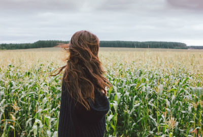 Woman standing on field