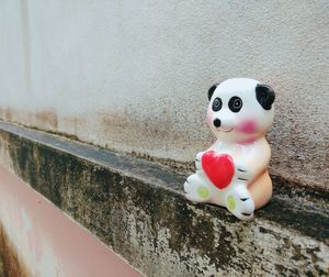 Close-up of toy on wall