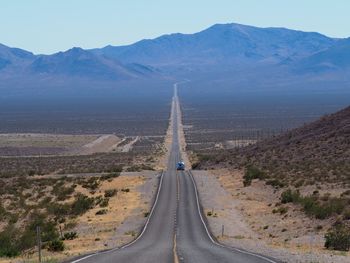 Panoramic view of road passing through desert