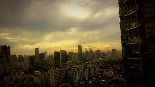 Cityscape against sky at sunset