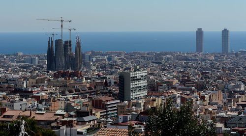 Aerial view of city buildings against sky