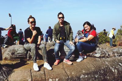 Portrait of friends sitting outdoors