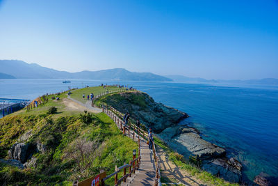 High angle view of sea against clear blue sky