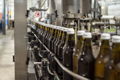 Close-up of wine bottles in industry