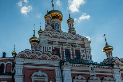 Low angle view of bell tower against sky