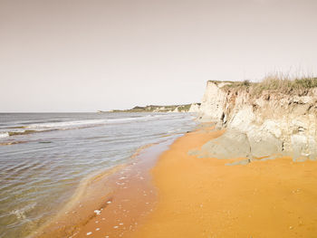 Scenic view of beach against clear sky