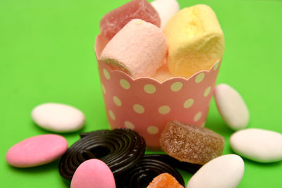 Close-up of multi colored candies on table