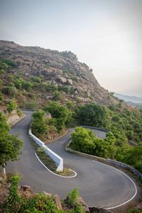 Scenic view of mountain road against sky