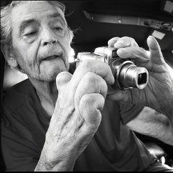 Portrait of man holding camera