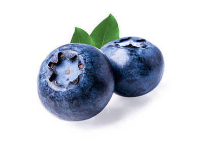 Close-up of fruit against white background