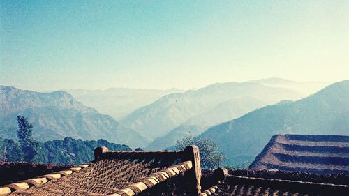 Scenic view of mountains with cots in foreground