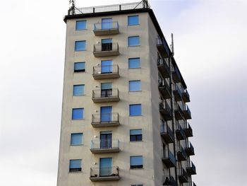 Low angle view of office building against sky