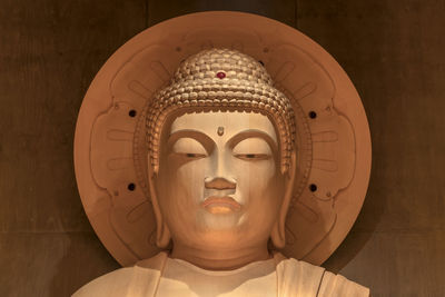 Close-up of statue against building