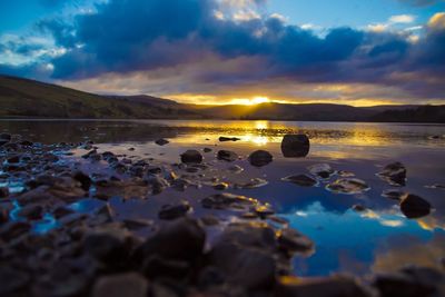 Scenic view of lake against romantic sky