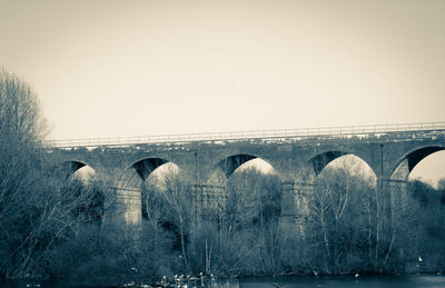 Low angle view of arch bridge against clear sky