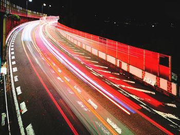 High angle view of light trails on highway at night