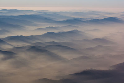 Scenic view of mountains against sky during sunset